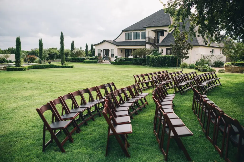 A lawn with many chairs in the grass