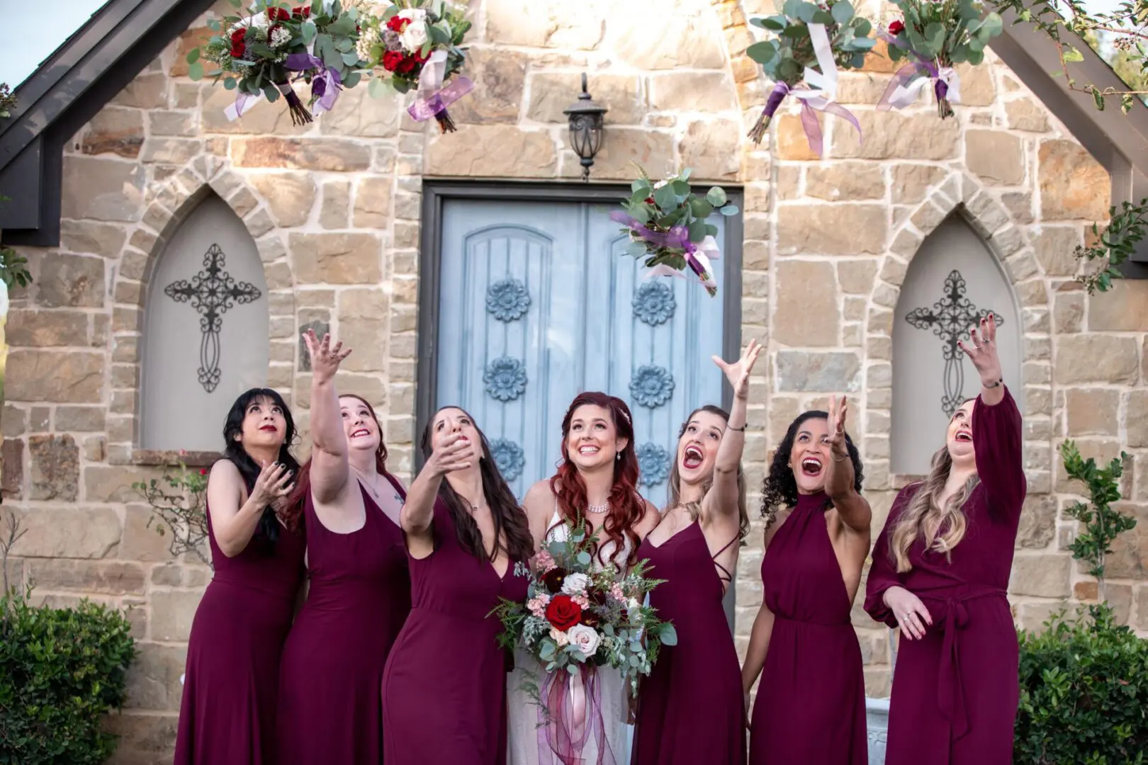 Bride and bridesmaids toss bouquets.