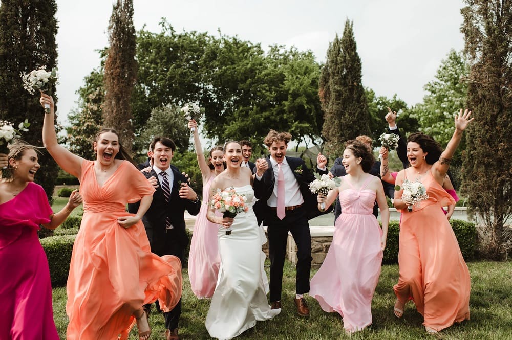 Bride and bridesmaids joyfully running.