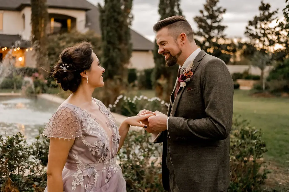 Bride and groom exchanging rings.